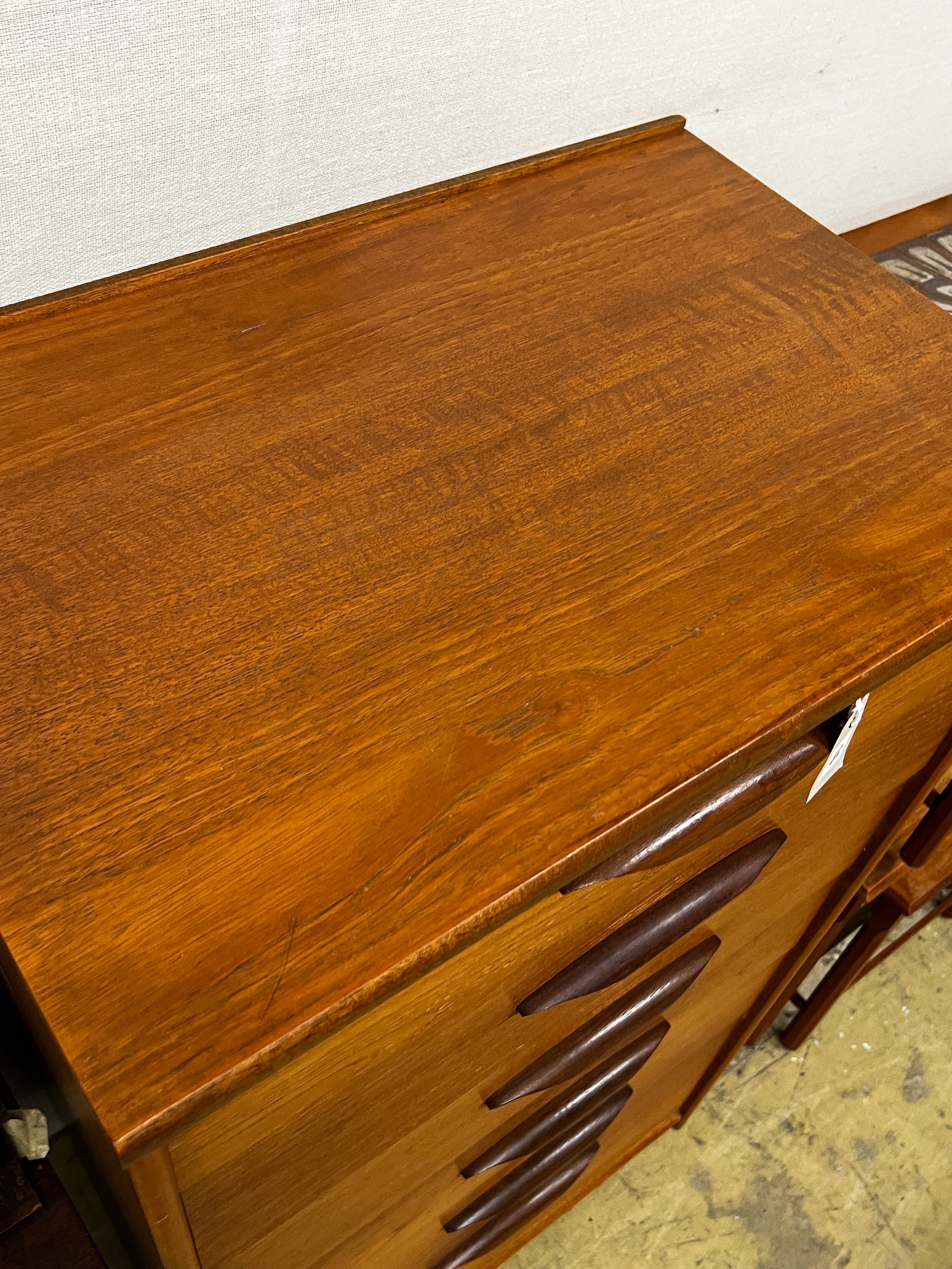 A mid century Austinsuite teak six drawer chest, width 64cm, depth 43cm, height 116cm